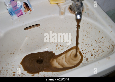 Faucet Coming Out Water In The White Sink Stock Photo 262038116