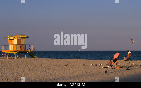 bathers and lifeguard tower in the late afternoon in South Beach Miami Florida USA Stock Photo