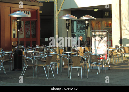 Town centre winter view of outdoor Costa coffee bar equipped with large outdoor gas space heaters Stock Photo