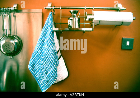 Kitchen utensils on racks Stock Photo
