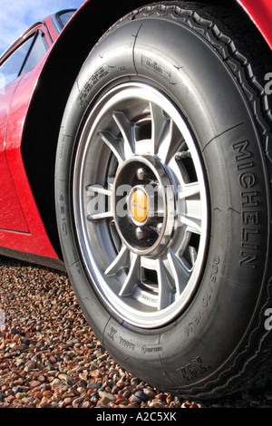 Close up of Ferrari Dino 246 GT Wheel parked on gravel Stock Photo