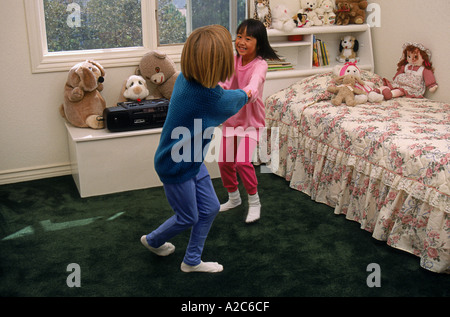 Two young girls  6-7 dancing playing play in bedroom  vintage Boombox   MR  © Myrleen Pearson Stock Photo