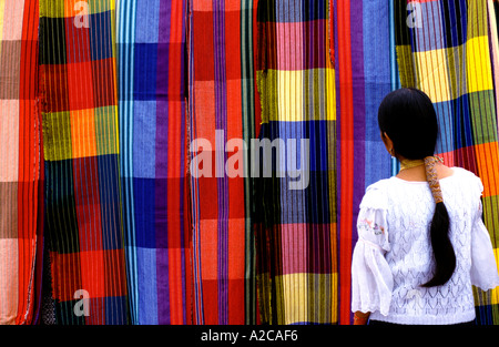 Local woman looking hammocks. Otavalo market. Ecuador Stock Photo