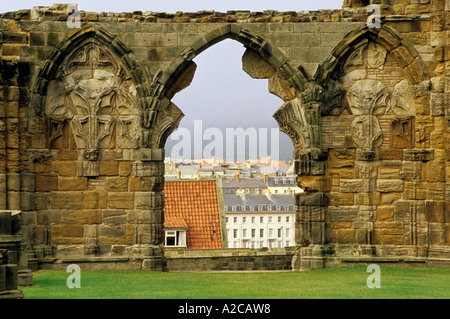 Whitby town seen through a broken arch of the Abbey ruins Stock Photo