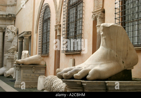 In the courtyard of the Palazzo dei Conservatori of the Campidoglio in Rome  are pieces of a giant statue of Emperor Constantine Stock Photo