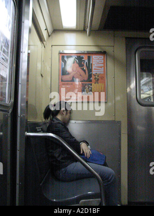 Young woman sleeping in New York City subway train USA Stock Photo - Alamy