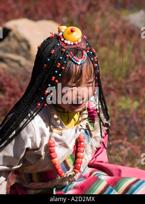 cute Tibetan girl with braids Stock Photo