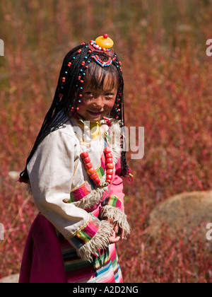 cute Tibetan girl with traditional dress and braids Stock Photo