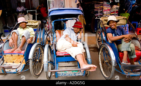 Trishaw drivers take a rest in Phnom Penh. Stock Photo