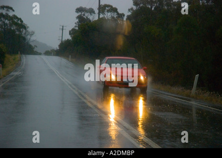 Cars driving in heavy rain Stock Photo