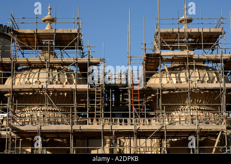 The domes of the Prince Regents Palace The Royal Pavilion Brighton East Sussex are covered in scaffolding for stonework repairs Stock Photo