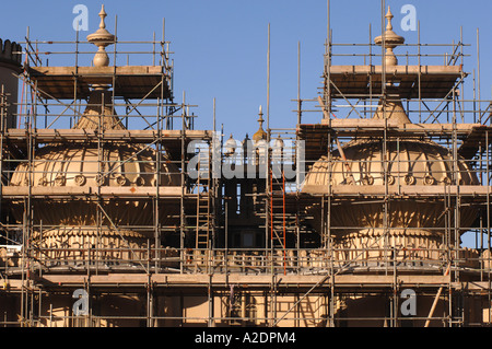 The domes of the Prince Regents Palace The Royal Pavilion Brighton East Sussex are covered in scaffolding for stonework repairs Stock Photo