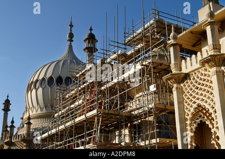 The domes of the Prince Regents Palace The Royal Pavilion Brighton East Sussex are covered in scaffolding for stonework repairs Stock Photo