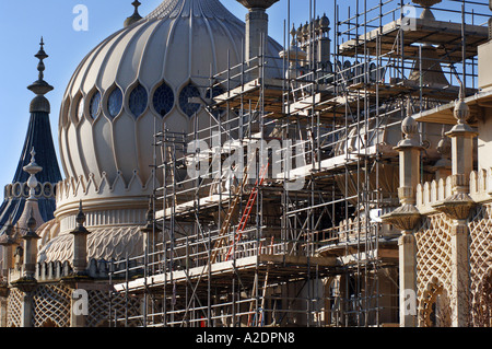 The domes of the Prince Regents Palace The Royal Pavilion Brighton East Sussex are covered in scaffolding for stonework repairs Stock Photo