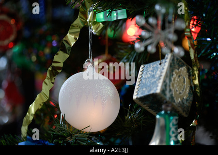 Christmas baubles on Christmas tree close-up Stock Photo