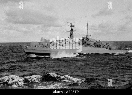 Type 21 HMS Ardent fires its Mk8 gun alongside SS Canberra during the Falklands Conflict in 1982 Stock Photo