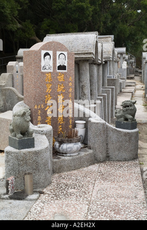 dh  CHEUNG CHAU HONG KONG Chinese graveyard rows of gravestones in woodland cemetery