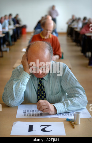 CONTESTANTS AT THE TIMES NATIONAL CROSSWORD COMPETITION CUP DURING THE CHAMPIONSHIPS IN CHELTENHAM UK 2006 Stock Photo