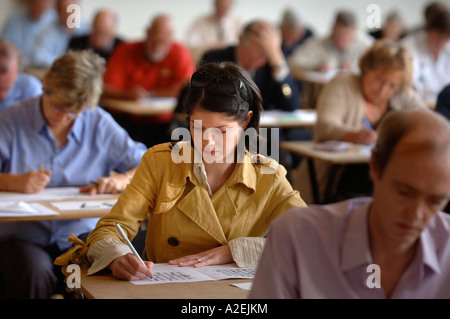 A YOUNG FEMALE CONTESTANT AT THE TIMES NATIONAL CROSSWORD COMPETITION CUP DURING THE CHAMPIONSHIPS IN CHELTENHAM UK 2006 Stock Photo