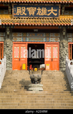 dh Po Lin Monastery LANTAU HONG KONG Joss stick burner urn entrance steps to chinese temple China temples ancient buddhism island Stock Photo