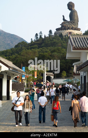 dh Ngong Ping 360 village LANTAU HONG KONG Tourist in main thoroughfare and Tian Tan Buddha statue tourists island Stock Photo