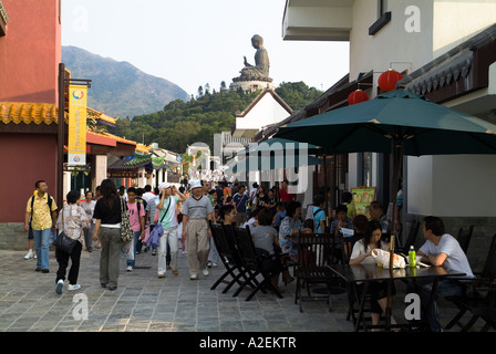 dh Ngong Ping 360 village LANTAU HONG KONG Tourist in main thoroughfare cafe and Tian Tan Buddha statue island Stock Photo