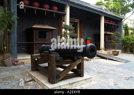dh Kowloon Walled City Park KOWLOON PARK HONG KONG Seige cannon gun outside Almshouse alms house