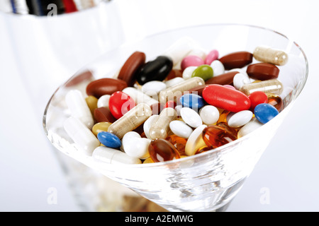 Pills in cocktail glass, close-up Stock Photo