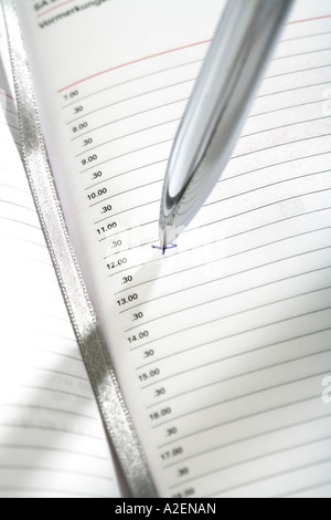 Diary and ball-point, close-up Stock Photo