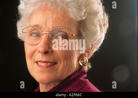 MATURE WOMAN WEARING GLASSES Stock Photo