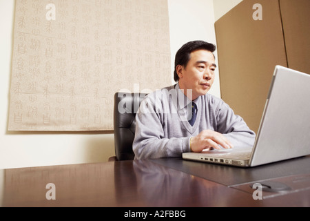 Businessman using a laptop Stock Photo