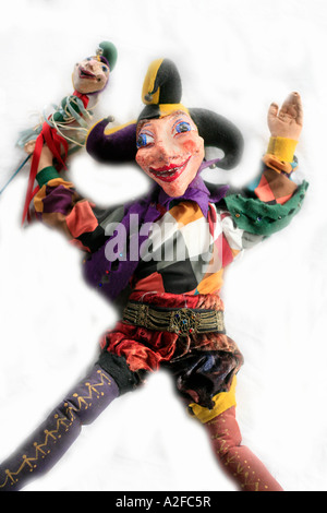A joker or Mister Punch puppet on white background Stock Photo
