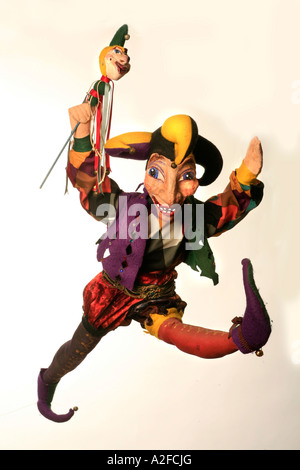 A highly colorful jester or joker puppet Stock Photo