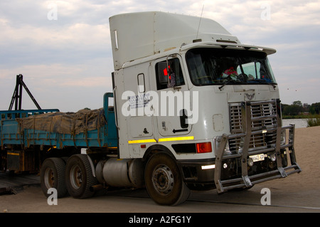 Truck from South Africa is disembarking from a ferry between Botswana and Zambia, Kazungula, border station Botswana- Zambia Stock Photo