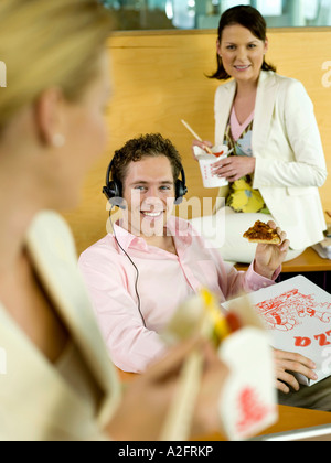Young professionals having luch break in office Stock Photo