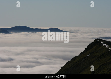 View South West from Blencathra in the English lake district across clouds to mountain tops. Stock Photo