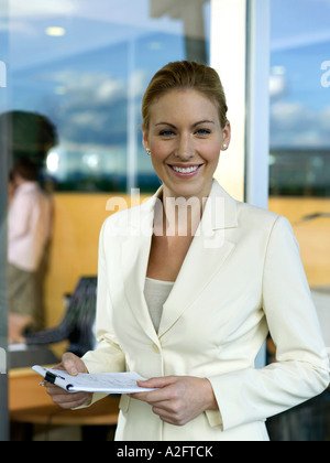 Young woman holding writing pad Stock Photo
