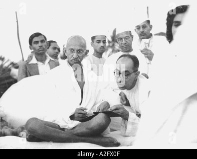 Mahatma Gandhi with secretary Pyarelal Nayar and Buddhist monk visiting ...