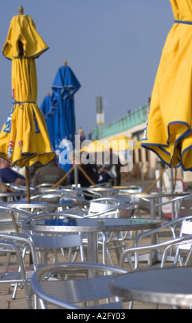 Brighton beachfront cafe with yellow and blue parasol Stock Photo