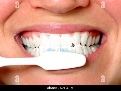 woman brushing her teeth Stock Photo