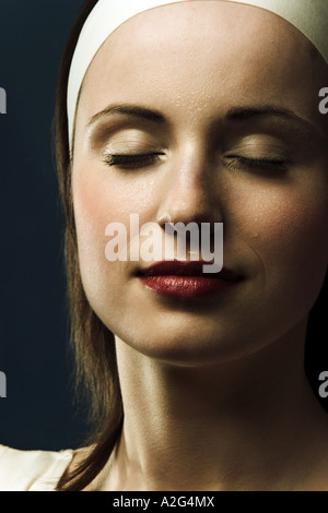 1220884 indoor studio woman young 25 30 brunette long hair eye eyes close portrait close up smile smiling make up lip lip Stock Photo