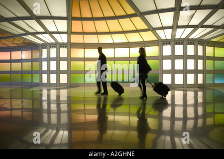 USA, Illinois, Chicago: O'Hare International Airport, Commuters (NR) Passageway at United Airlines Terminal Stock Photo