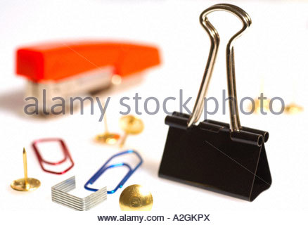Paperclips, drawing pins, staples and stapler, bulldog clip Stock Photo