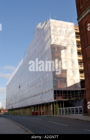 Old mill building being renovated and redeveloped in Pollard Street East Manchester UK Stock Photo