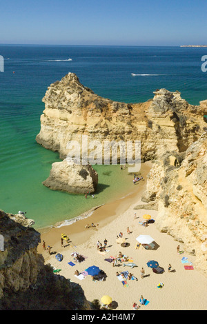 Portugal the Algarve Alvor Praia dos tres irmaos beach and cliffs in summer Stock Photo