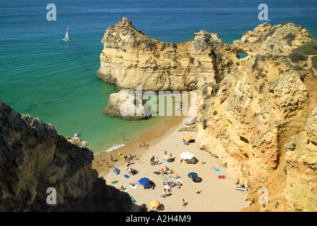 Portugal the Algarve Alvor Praia dos tres irmaos beach and cliffs in summer Stock Photo