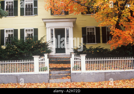 New England home with a white picket fence in autumn Concord Massachusetts 2002 Stock Photo