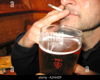 smoking roll up tobacco bath u k Stock Photo