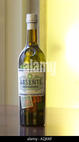 Bottle of Absente a brand of Absinthe Pastis is a spirit high alcohol drink flavoured flavored with herbs such as anise (badiane, anis étoilé etoile) and other spices. It is sometimes called pastis or Absinth absinthe. It is served in a tall glass with ice and you pour water on it. It gets cloudy milky when water is added. It is a favourite drink aperitif in Provence Southern France. Stock Photo