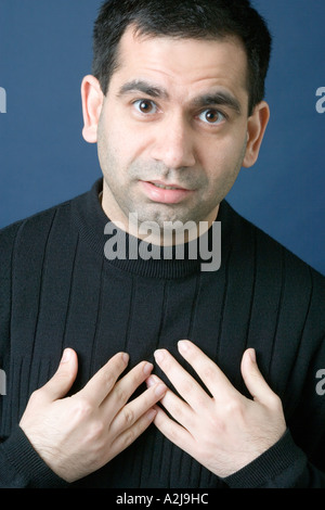 Man covering his eyes with his hands Stock Photo